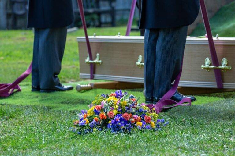 coffin being lowered into a grave